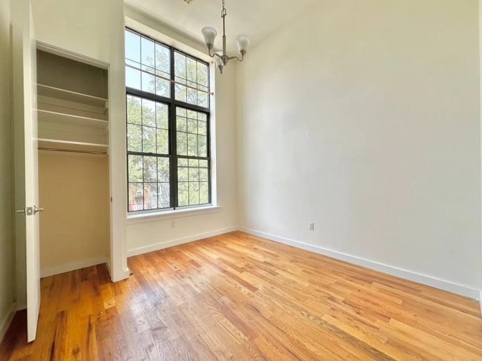 Bedroom in a Brooklyn apartment with a large window