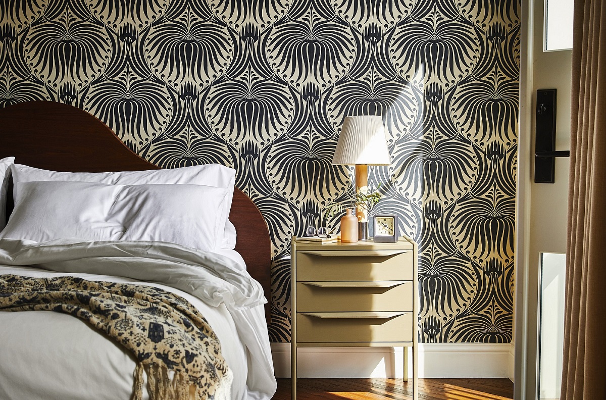 detail of bed and patterned wallpaper in The Pinch