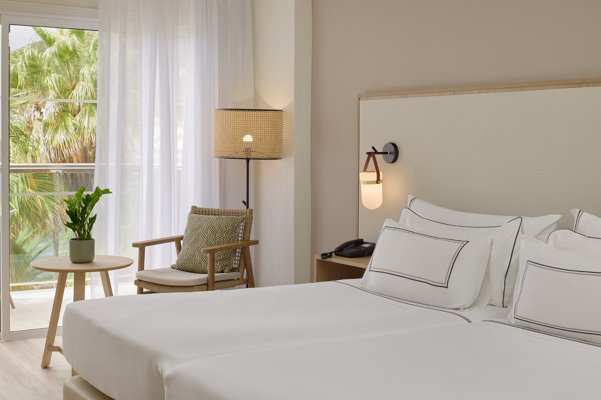 whites and neutrals in guestroom at Melia La Palma with views over palm trees