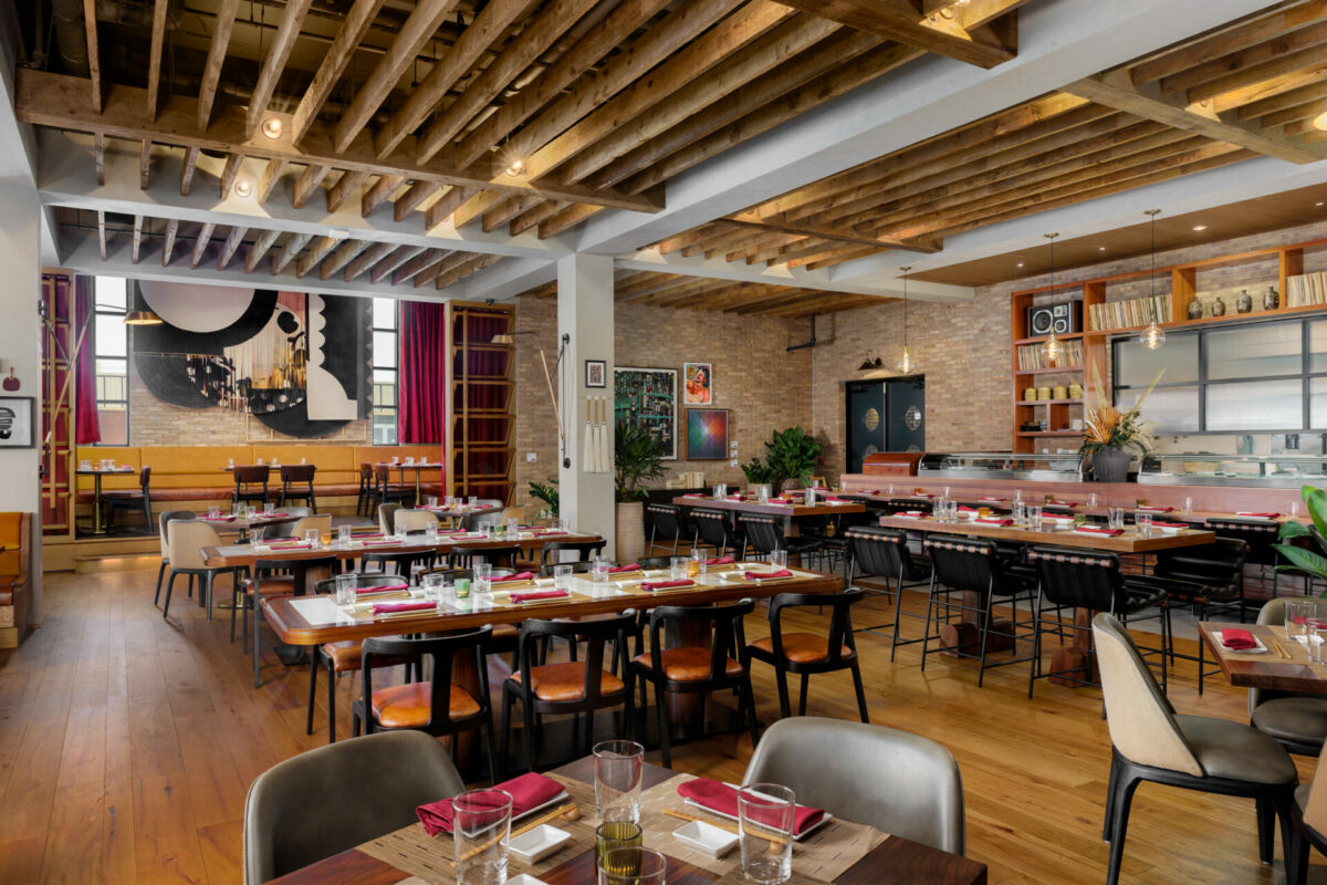 Motto by Hilton Downtown Bentonville: Industrial style sushi restaurant - wooden beams line the ceiling, with trellis style tables