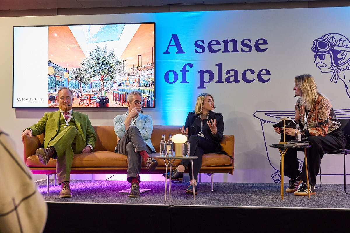 Hotel Designs Editor Sophie Harper leads a panel discussion entitled 'Leave No Trace' on the main stage at HIX 2024, with guests Louis Thompson, Jerry Tate, and Anomien Smith. 