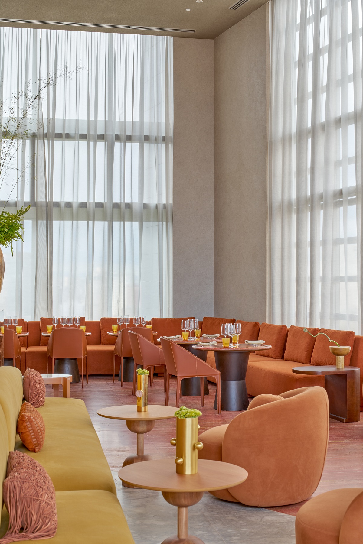 gold, mustard and pink seating and tables in high volume public area