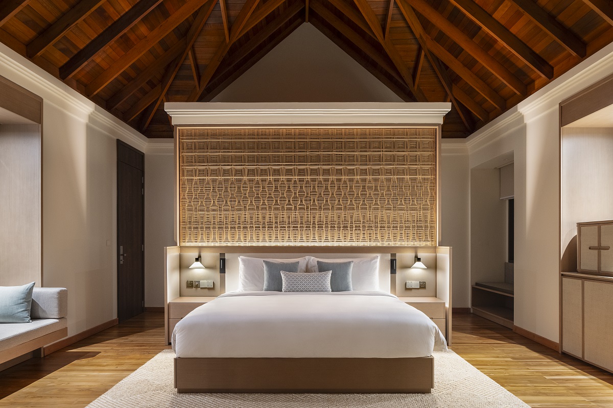 double bed in guestroom with traditionally woven wicker headboard