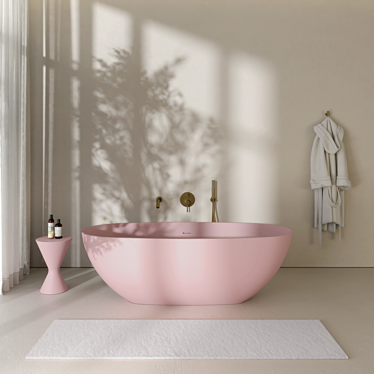 blossom pink freestanding bath from Nosa with white mat and pink table