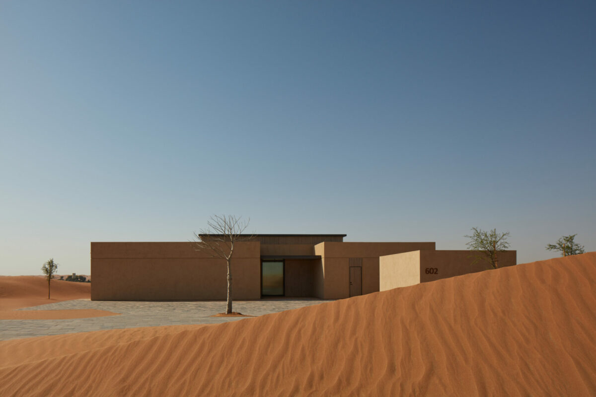 Exterior shot of the rectangular barasti-style Ritz Carlton signature villa in Dubai desert