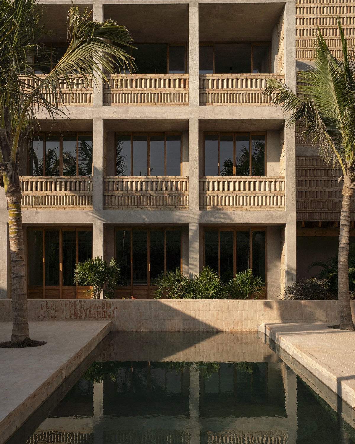 concrete, clay and brick facade with pool in Hotel Humano