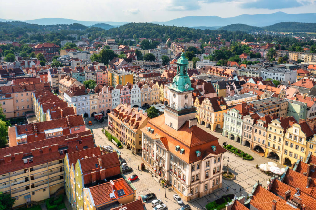 Jelenia Gora in Poland. Aerial view of a European town square, one of the best places to visit, with colorful buildings and a central historic tower. 